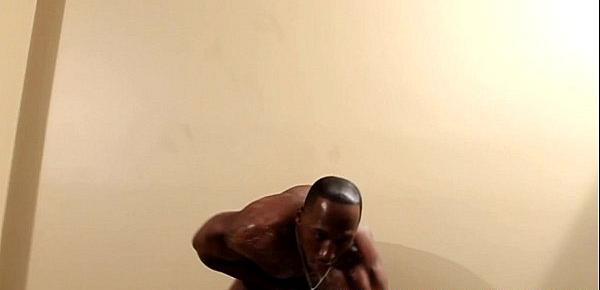  Muscular black hunk soaps up his cock